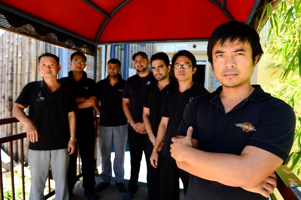 Saigon Saigon owner Tai Lam (far right) with staff members Hua, Ryan, Mahesh, Vishal Gaur, Harry and Steven. People have been throwing rocks at customers in their restaurant. Photo Sharyn O'Neill / The Morning Bulletin Saigon Saigon owner Tai Lam (far right) with staff members Hua, Ryan, Mahesh, Vishal Gaur, Harry and Steven. People have been throwing rocks at customers in their restaurant. Photo Sharyn O'Neill / The Morning Bulletin