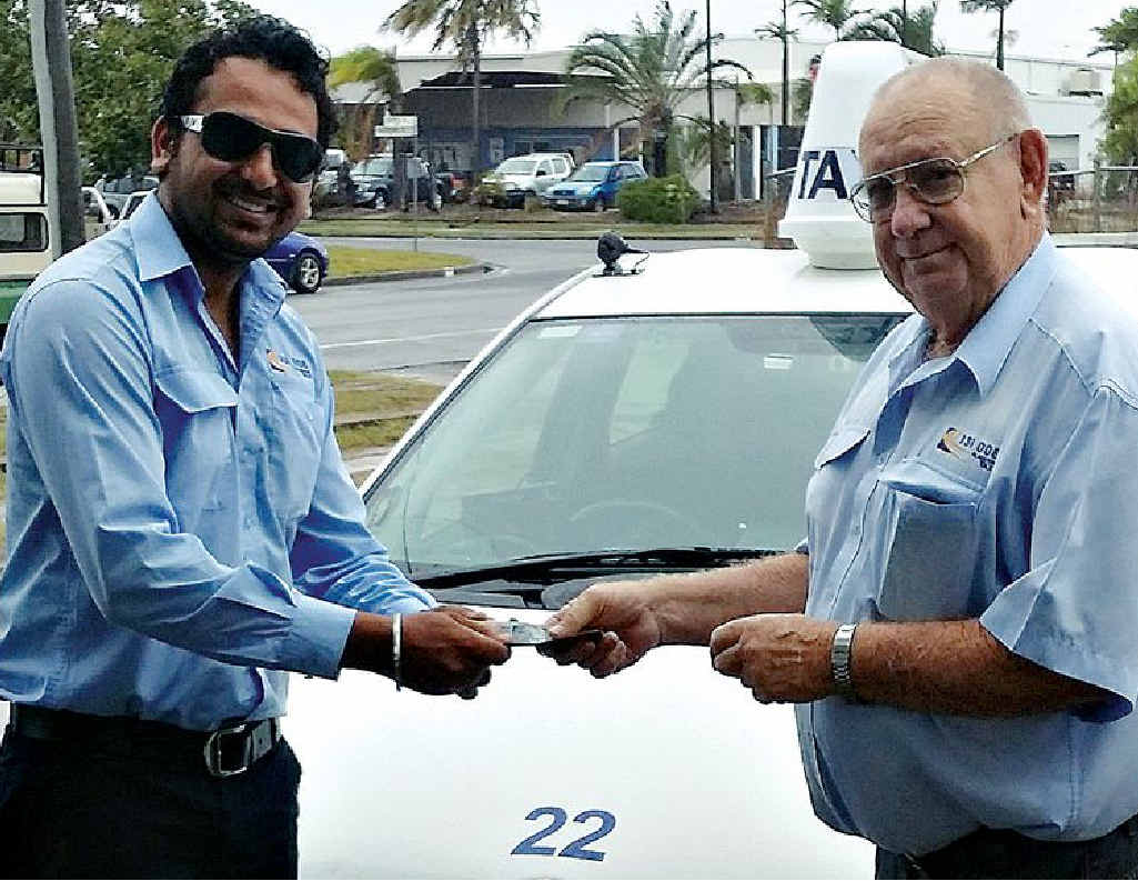 PAYBACK: Amrik Singh Sidhu hands over a sum of money he found in the back seat of his vehicle to Blue and White Taxis’ Allan Rowe. PAYBACK: Amrik Singh Sidhu hands over a sum of money he found in the back seat of his vehicle to Blue and White Taxis’ Allan Rowe.