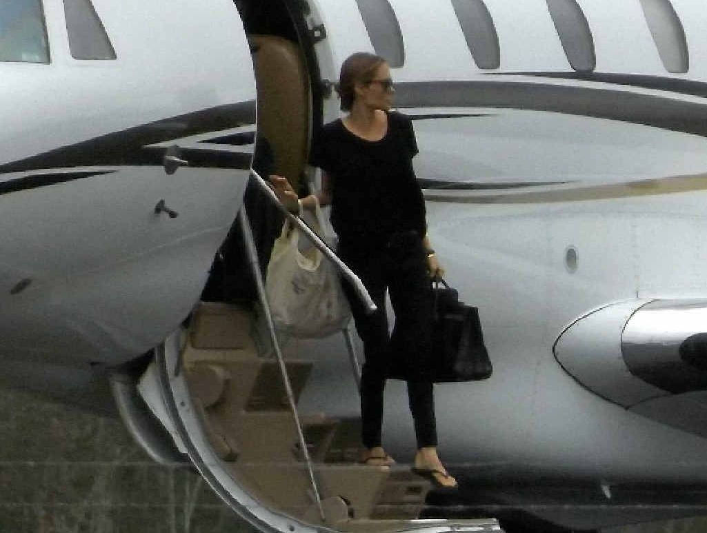 Hollywood actress Angelina Jolie steps off a plane at Whitsunday Coast Airport. The star is in town to direct her film Unbroken. Hollywood actress Angelina Jolie steps off a plane at Whitsunday Coast Airport. The star is in town to direct her film Unbroken.