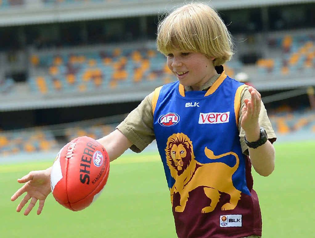 Robert Irwin tests the Gabba playing surface as (top left) Australia Zoo tiger handlers Ethan Kimmince and Simon Husher talk with Lions players Pearce Hanley, Patrick Weardon, Marco Paparone and Daniel Merrett. Robert Irwin tests the Gabba playing surface as (top left) Australia Zoo tiger handlers Ethan Kimmince and Simon Husher talk with Lions players Pearce Hanley, Patrick Weardon, Marco Paparone and Daniel Merrett.