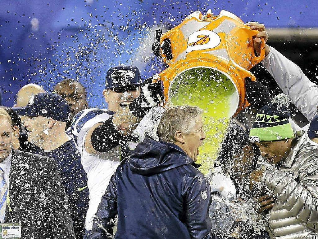 SPLASH: Seattle Seahawks head coach Pete Carroll is doused with Gatorade in the final minutes of the Super Bowl XLVIII win against the Denver Broncos. SPLASH: Seattle Seahawks head coach Pete Carroll is doused with Gatorade in the final minutes of the Super Bowl XLVIII win against the Denver Broncos.