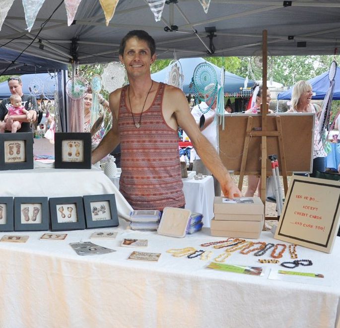 Artist Renton Bishopric pictured at his Stamp Your Feet stall at Figtree markets. Renton is taking his art one step further by preserving a unique time capsule for the community to enjoy. Photo Trish Bowman / Capricorn Coast Mirror