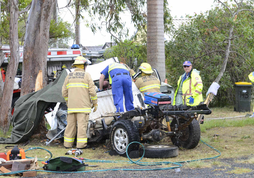 ACCIDENT SCENE: Emergency services personnel attend the crash site. ACCIDENT SCENE: Emergency services personnel attend the crash site.