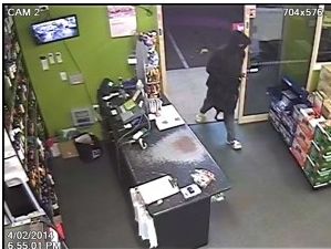 Still images from CCTV footage of the armed hold-up at Kepnock. Still images from CCTV footage of the armed hold-up at Kepnock.