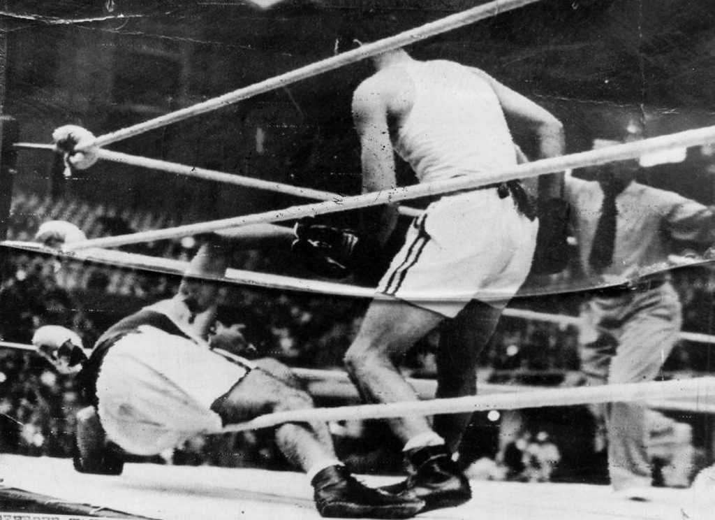 Adrian Holmes, knocks an opponent to the mat in the London Olympics, 1948 Adrian Holmes, knocks an opponent to the mat in the London Olympics, 1948