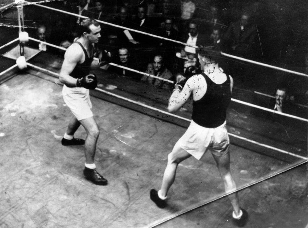 Adrian Holmes (left) boxing for Australia during the 1948 London Olympics. Adrian Holmes (left) boxing for Australia during the 1948 London Olympics.