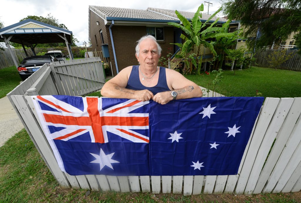 FLAG WILL FLY: Goodna Vietnam veteran Neville Irwin is delighted Department of Housing Minister Tim Mander has given him the green light to fly the Australian flag FLAG WILL FLY: Goodna Vietnam veteran Neville Irwin is delighted Department of Housing Minister Tim Mander has given him the green light to fly the Australian flag