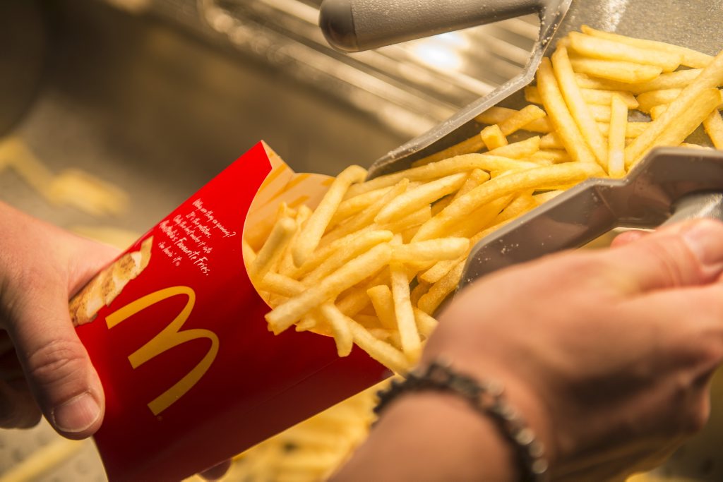 Fries being prepared at a McDonalds restaurant. Fries being prepared at a McDonalds restaurant.