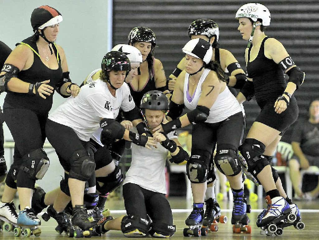 Sugar ’n’ Strife takes a fall in a bout at Epic Scrim. Sugar ’n’ Strife takes a fall in a bout at Epic Scrim.