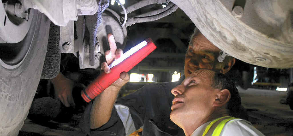 RIGHT WAY: Tony Abbott inspects truck mechanics with workshop fitter Richard Michel at Rocky’s Own Transport. RIGHT WAY: Tony Abbott inspects truck mechanics with workshop fitter Richard Michel at Rocky’s Own Transport.