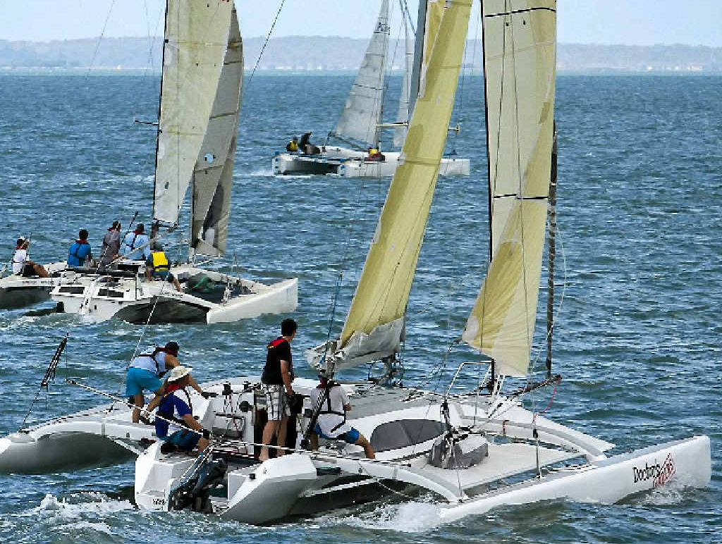 ROCKET SHIPS: Three multi-hull yachts line up for the first mark. ROCKET SHIPS: Three multi-hull yachts line up for the first mark.