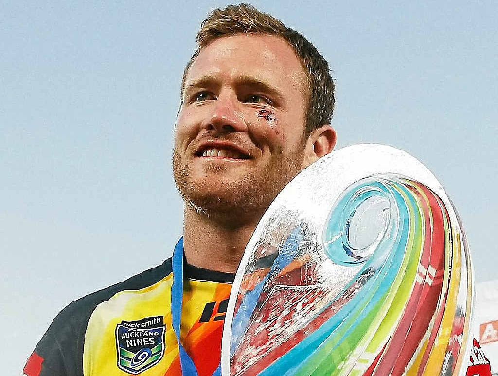 PROUD: Cowboys skipper Gavin Cooper holds up the Auckland Nines trophy. PROUD: Cowboys skipper Gavin Cooper holds up the Auckland Nines trophy.