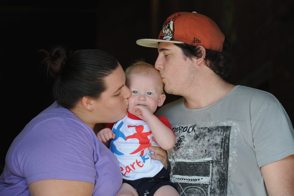 One year old Lukus Clemson endured open-heart surgery when he was four months old. He is pictured with his devoted parents Danielle Holman and Angus Clemson. One year old Lukus Clemson endured open-heart surgery when he was four months old. He is pictured with his devoted parents Danielle Holman and Angus Clemson.