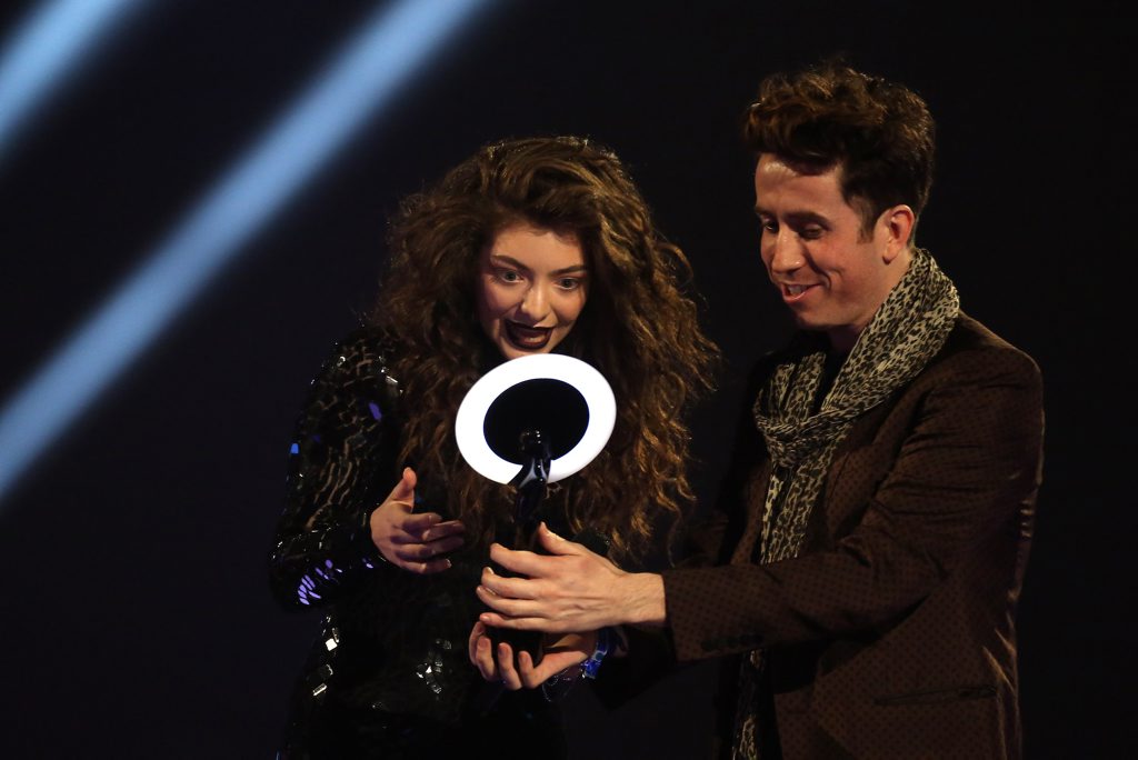 New Zealand singer-songwriter Lorde accepting the award for International Female Solo Artist from Nick Grimshaw at the BRIT Awards. New Zealand singer-songwriter Lorde accepting the award for International Female Solo Artist from Nick Grimshaw at the BRIT Awards.