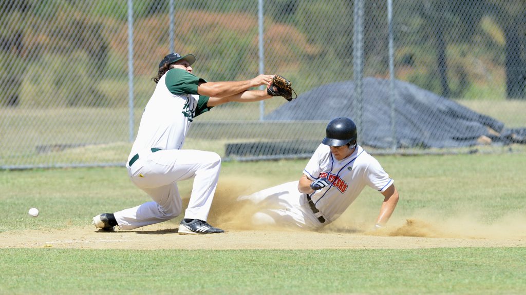Image for sale: Gregg Ellis of the Musketeers slides into third base on Sunday. Photo: Rob Williams / The Queensland Times