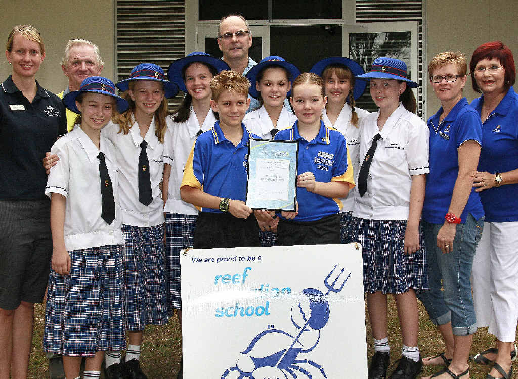 REEF GUARDIANS: Kalkie students Duncan Allen and Bridget Keightley proudly hold the South Queensland Reef Guardian Award, along with Lukaeja Morrison, Holly Smith, Gretel McGeorge, Natalie Schiffke, Regan Caldwell and Jessica Valuch, Rhianna Ricckard, Steve Tilley, Patrick Cause, Carolyn Caldwell and Sharlene Peterson. REEF GUARDIANS: Kalkie students Duncan Allen and Bridget Keightley proudly hold the South Queensland Reef Guardian Award, along with Lukaeja Morrison, Holly Smith, Gretel McGeorge, Natalie Schiffke, Regan Caldwell and Jessica Valuch, Rhianna Ricckard, Steve Tilley, Patrick Cause, Carolyn Caldwell and Sharlene Peterson.