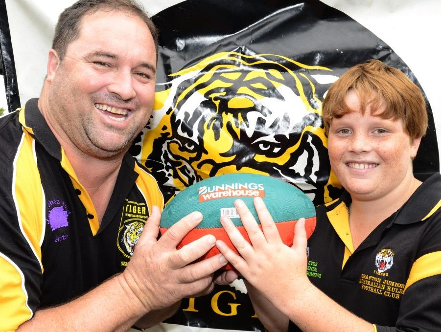 Wayne 'Tank' Phillips and his son Dylan,12, of Grafton manage to fit in a number of sports after school and the weekend and were at the sports sign at Bunnings South Grafton on Saturday. Photo Debrah Novak / The Daily Examiner
