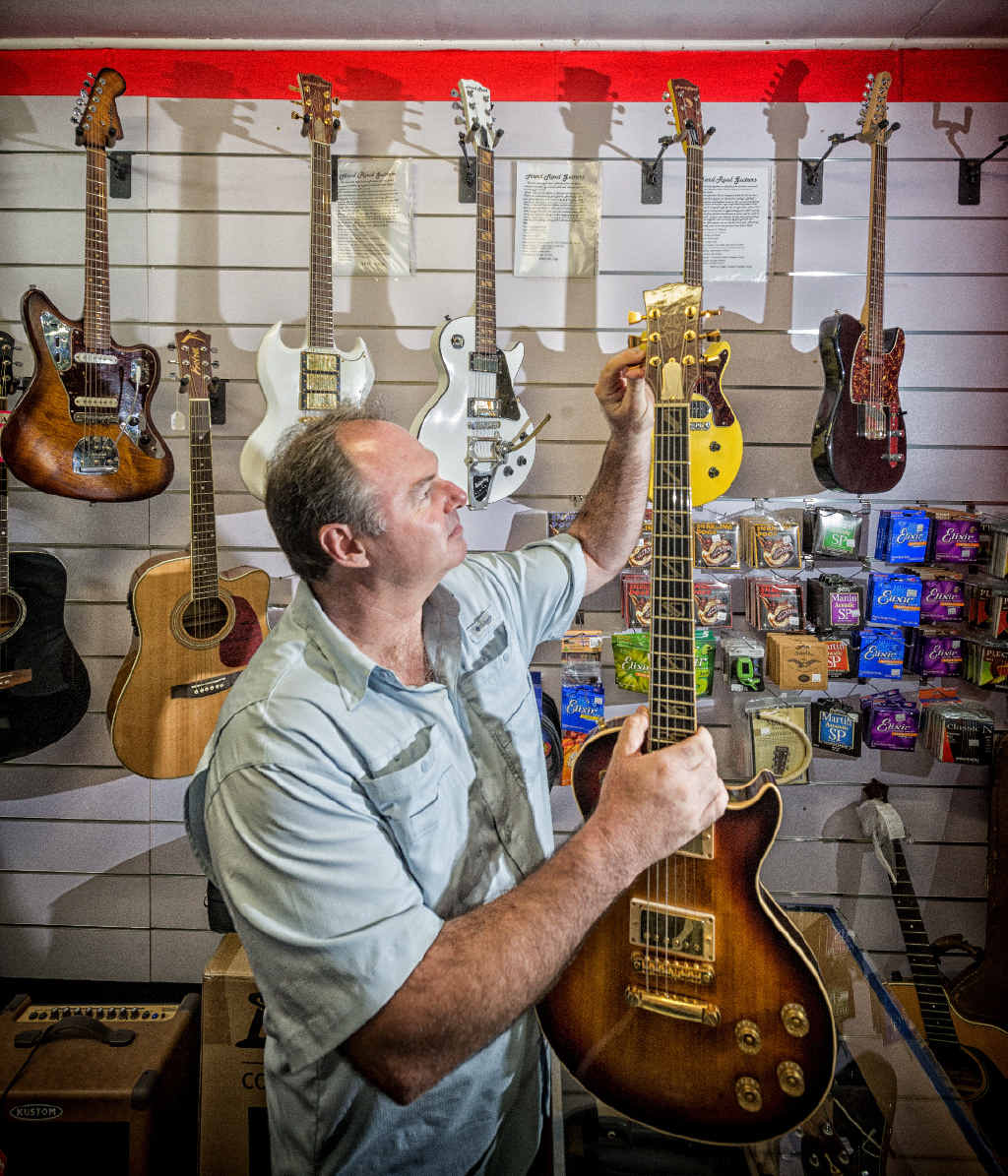 MUSIC BUSINESS: Paul Kneller of Garage Music with one of his Hard Road handmade guitars. Photo: Adam Hourigan MUSIC BUSINESS: Paul Kneller of Garage Music with one of his Hard Road handmade guitars. Photo: Adam Hourigan