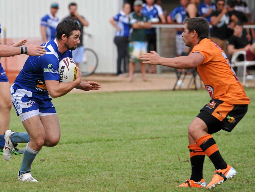 DETERMINED: Bryce Woodmass, left, takes on the Wallabys defence with plenty of gusto. DETERMINED: Bryce Woodmass, left, takes on the Wallabys defence with plenty of gusto.