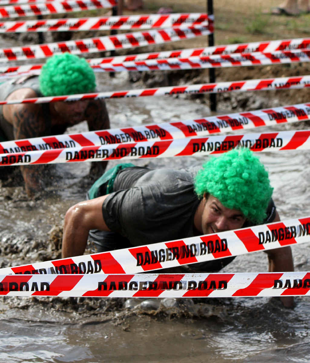 MUD MADNESS: Crossfit Vivid team members work their way through the mud sludge. MUD MADNESS: Crossfit Vivid team members work their way through the mud sludge.