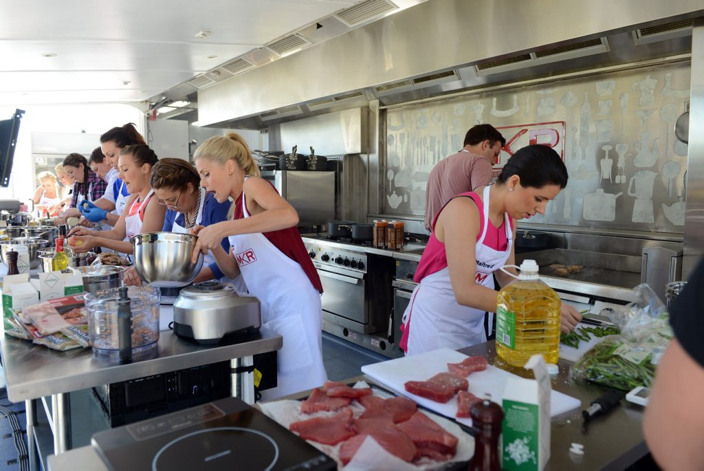 Contestants from the white group cook in the new MKR food truck. Contestants from the white group cook in the new MKR food truck.