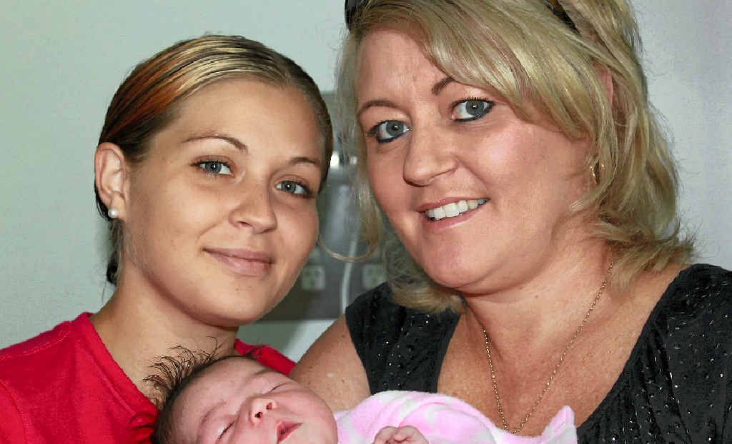 THREE GENERATIONS: Rockhampton’s Katie McLoughlin (left) with baby Allira and her mum Melita Smith. Allira was born in the bathroom of the family home at 11.34am, weighing in at a healthy 3430g (7lb 9oz). THREE GENERATIONS: Rockhampton’s Katie McLoughlin (left) with baby Allira and her mum Melita Smith. Allira was born in the bathroom of the family home at 11.34am, weighing in at a healthy 3430g (7lb 9oz).