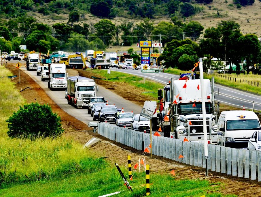 Traffic stretches back from the Summerholme Road exit on the Warrego Highway. A crash occurred about 8am near Rustys Oz Fuel service station. Initial reports were that a car has been crushed between two trucks. Extensive delays slowed traffic in both directions. Photo: Claudia Baxter / The Queensland Times Traffic stretches back from the Summerholme Road exit on the Warrego Highway. A crash occurred about 8am near Rustys Oz Fuel service station. Initial reports were that a car has been crushed between two trucks. Extensive delays slowed traffic in both directions. Photo: Claudia Baxter / The Queensland Times