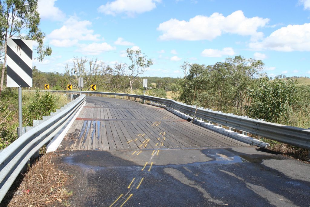 Paint marks on the road indicate where a car involved in a single vehicle rollover on Naughtons Gap Rd near Bentley travelled after impact. A 23-year-old Coraki woman died in the crash. Paint marks on the road indicate where a car involved in a single vehicle rollover on Naughtons Gap Rd near Bentley travelled after impact. A 23-year-old Coraki woman died in the crash.