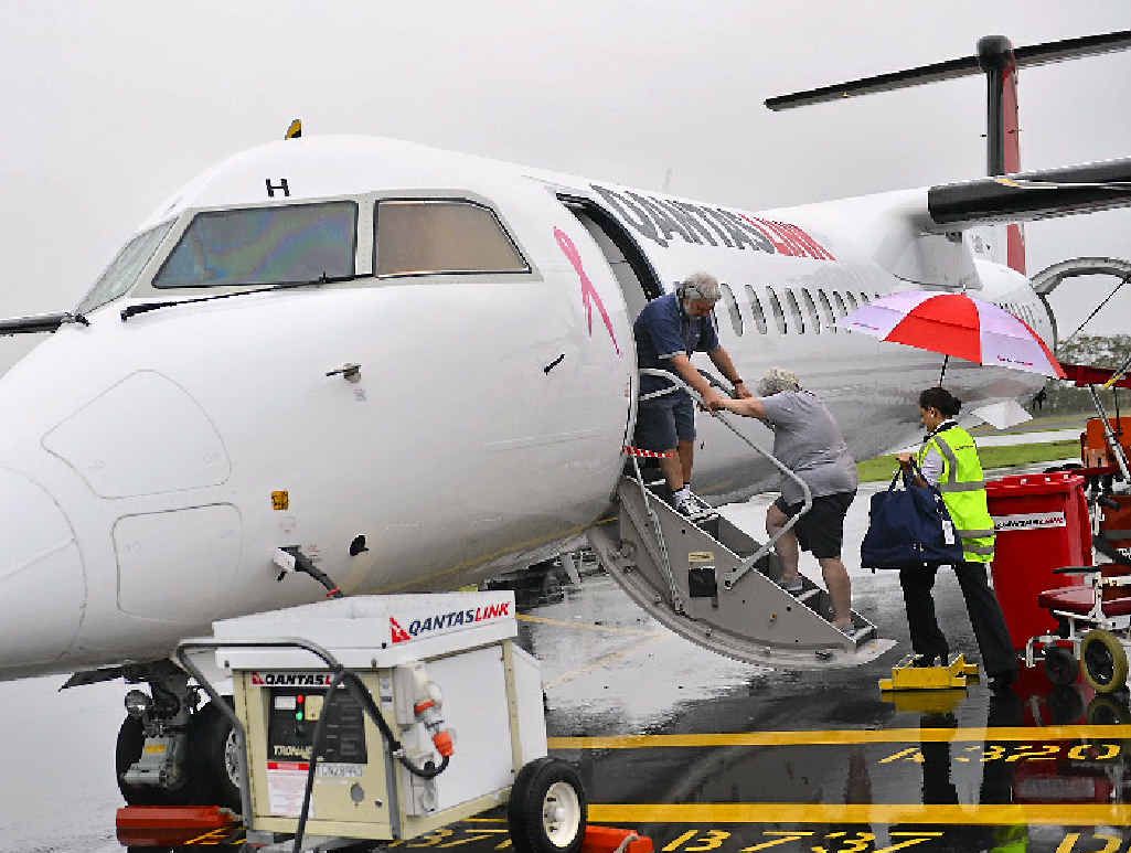 CANNED: Passengers on the first flight to Sydney last March. CANNED: Passengers on the first flight to Sydney last March.