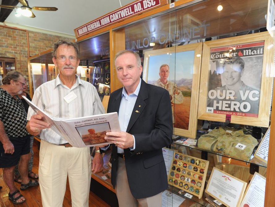 Maryborough Military and Colonial Museum owner John Meyers with retired Major General John Cantwell in front of the new display.