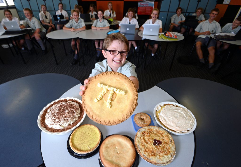Aydin Neighbours, aged 10 from St. John's College Woodlawn with fellow math students and a selection of pies for Pie Day. Photo Patrick Gorbunovs / The Northern Star Aydin Neighbours, aged 10 from St. John's College Woodlawn with fellow math students and a selection of pies for Pie Day. Photo Patrick Gorbunovs / The Northern Star