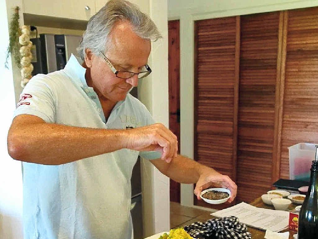 KITCHEN WHIZ: Scott Mathias adds pepper to his “cous cous”. KITCHEN WHIZ: Scott Mathias adds pepper to his “cous cous”.