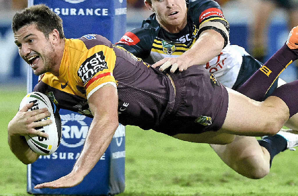 CUTTING EDGE: Matt Gillett of the Broncos scores a try against the North Queensland Cowboys at Suncorp Stadium last night. CUTTING EDGE: Matt Gillett of the Broncos scores a try against the North Queensland Cowboys at Suncorp Stadium last night.