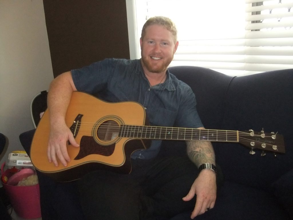 Shanon Watkins is a singer, song writer and guitarist from Darra. His new single has just gone number 2 in the charts in America. Also pictured is his 7 month old daughter Lola Watkins. Photo Contributed Shanon Watkins is a singer, song writer and guitarist from Darra. His new single has just gone number 2 in the charts in America. Also pictured is his 7 month old daughter Lola Watkins. Photo Contributed