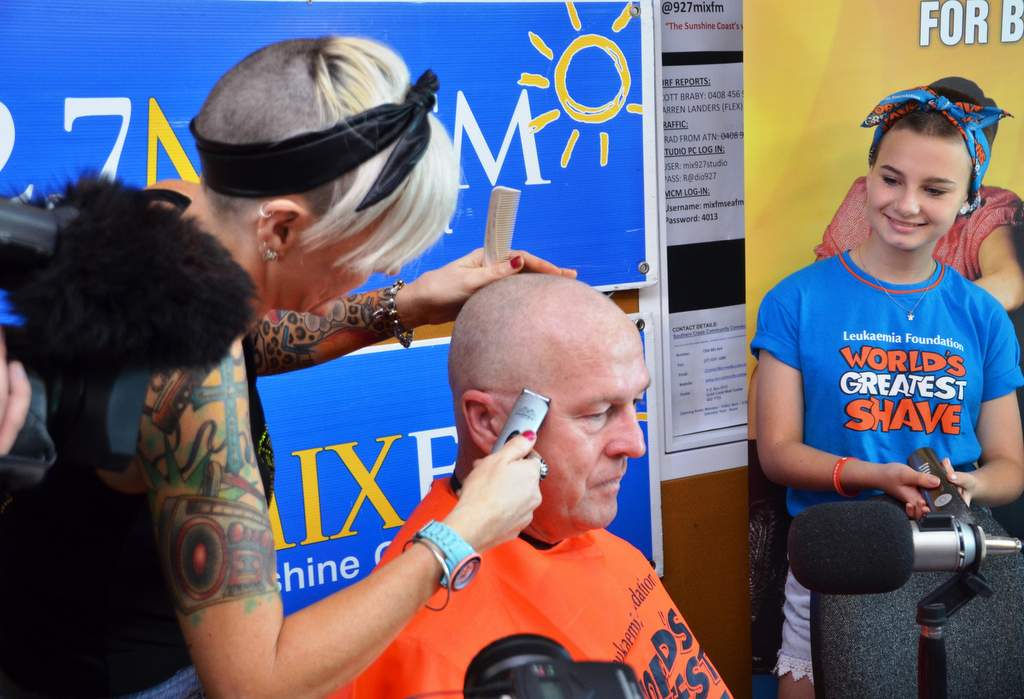 Mayor Mark Jamieson loses his hair for the cause as Adem Crosby’s sister Miranda from Team Adem looks on. Mayor Mark Jamieson loses his hair for the cause as Adem Crosby’s sister Miranda from Team Adem looks on.