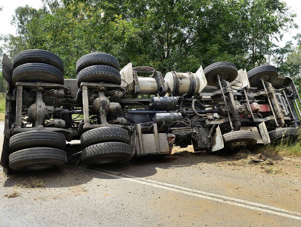 GOING NOWHERE: A waste-carrying truck that overturned on Swanbank Rd, Swanbank, yesterday and lost its load. GOING NOWHERE: A waste-carrying truck that overturned on Swanbank Rd, Swanbank, yesterday and lost its load.