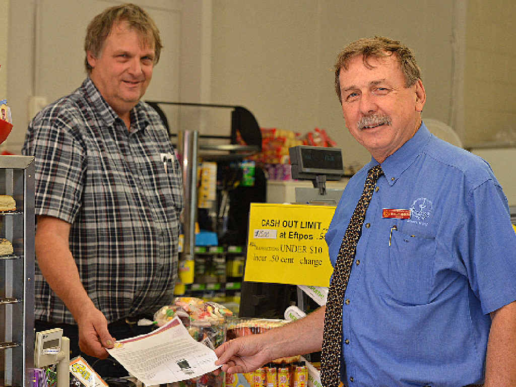 Tim Long from Long’s Crescent Road One Stop Shop with Gympie High principal Murray Wegner and one of the leave passes students will have to present to prove they are not wagging school. Tim Long from Long’s Crescent Road One Stop Shop with Gympie High principal Murray Wegner and one of the leave passes students will have to present to prove they are not wagging school.