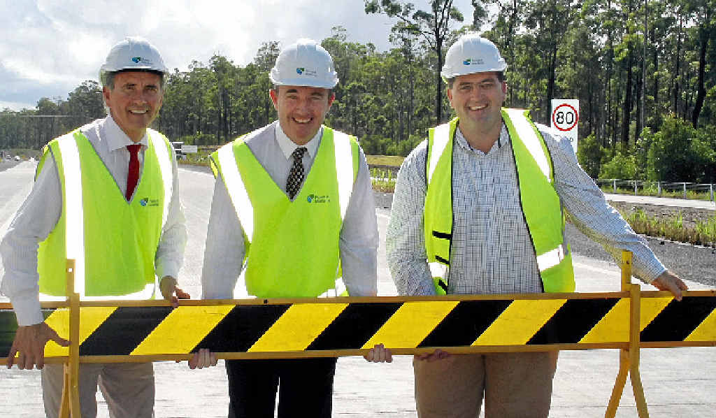 OPEN FOR BUSINESS: Clarence MP Chris Gulaptis, Page MP Kevin Hogan and Mayor of Clarence Valley Council/chair of the Pacific Highway Taskforce, Cr Richie Williamson, removing the barrier at the official opening of the Devil’s Pulpit Pacific Hwy upgrade yesterday. OPEN FOR BUSINESS: Clarence MP Chris Gulaptis, Page MP Kevin Hogan and Mayor of Clarence Valley Council/chair of the Pacific Highway Taskforce, Cr Richie Williamson, removing the barrier at the official opening of the Devil’s Pulpit Pacific Hwy upgrade yesterday.