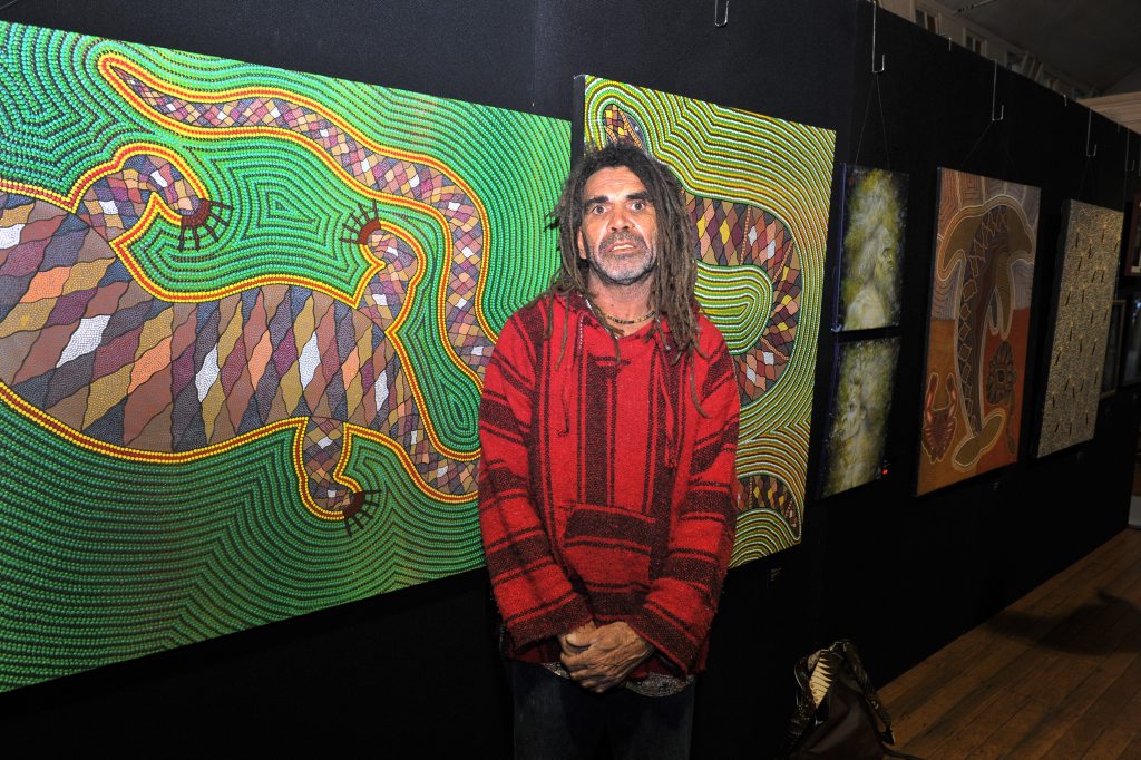 Artist, Gilbert Laurie in front of his paintings, Artist, Gilbert Laurie in front of his paintings,