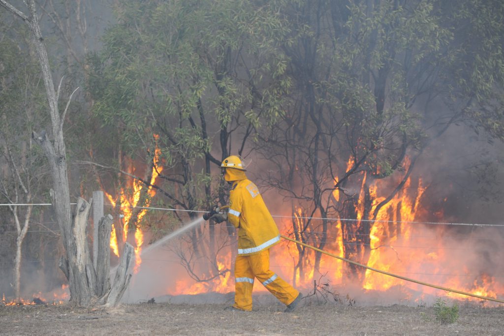 Rural firies at a fire burning on Dern's Dr at Takura on Sunday. Rural firies at a fire burning on Dern's Dr at Takura on Sunday.