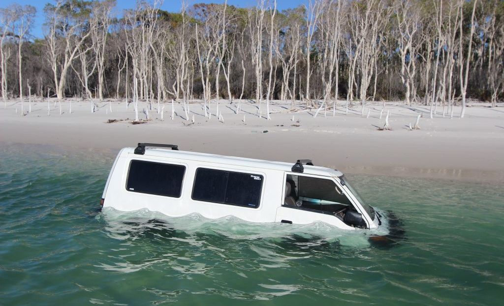 A four-wheel drive van underwater on Fraser Island. A four-wheel drive van underwater on Fraser Island.