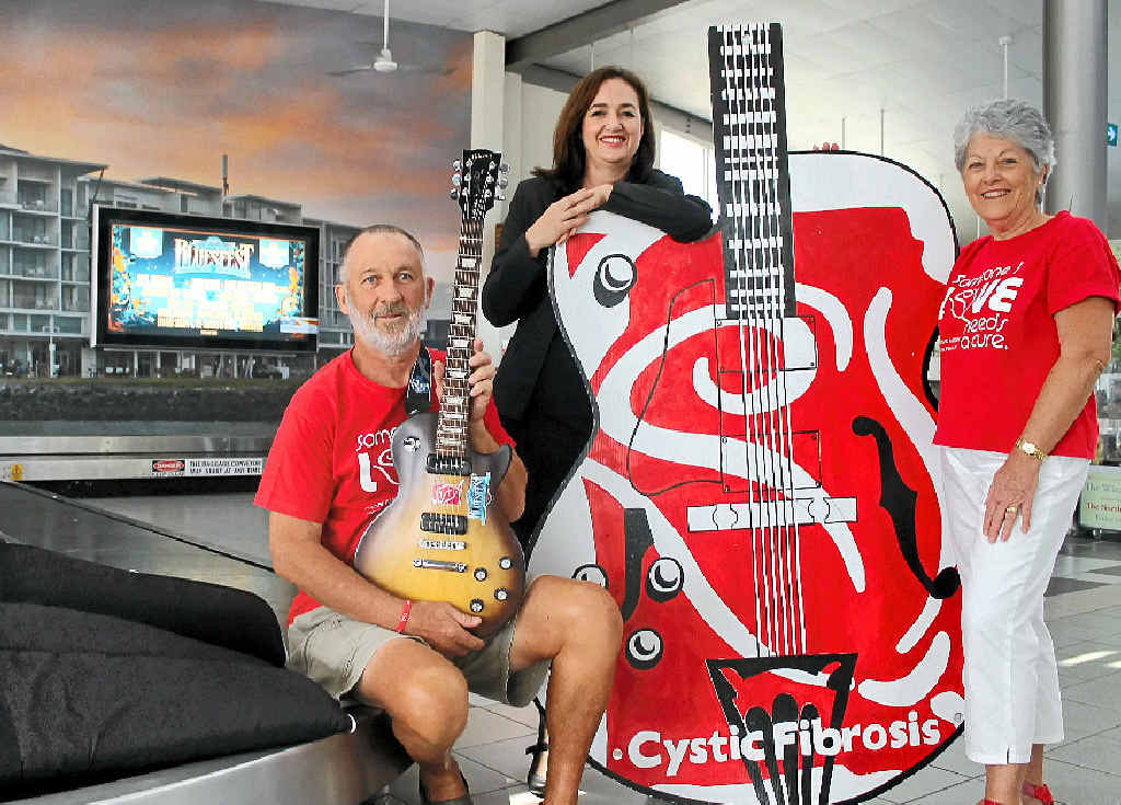 MUSICAL RAFFLE: Alan and Jenny Tunks, of Ballina, with Ramada Hotel and Suites general manager Karen Whiteford (centre) and the Gibson guitars being raffled in support of cystic fibrosis research. MUSICAL RAFFLE: Alan and Jenny Tunks, of Ballina, with Ramada Hotel and Suites general manager Karen Whiteford (centre) and the Gibson guitars being raffled in support of cystic fibrosis research.
