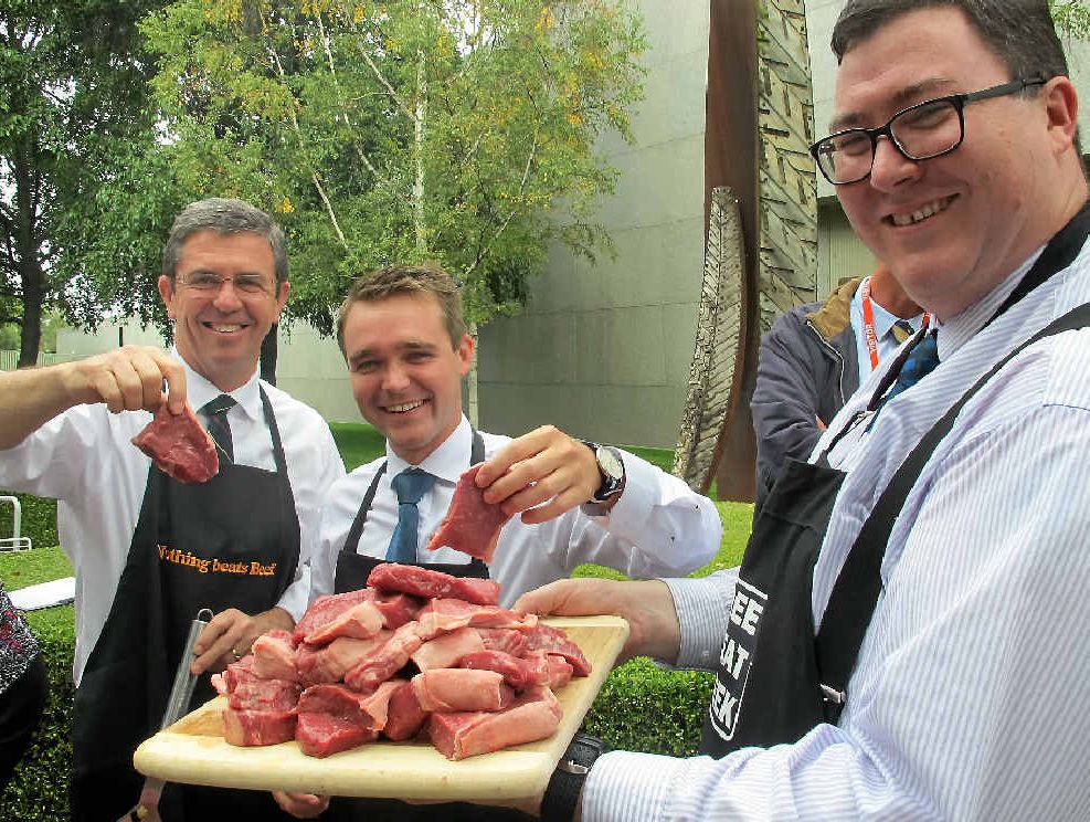 COOK-UP: At a Free Meat Week parliamentary barbecue are (from left) Lyne MP Kevin Hogan, Longman MP Wyatt Roy and Dawson MP George Christensen.