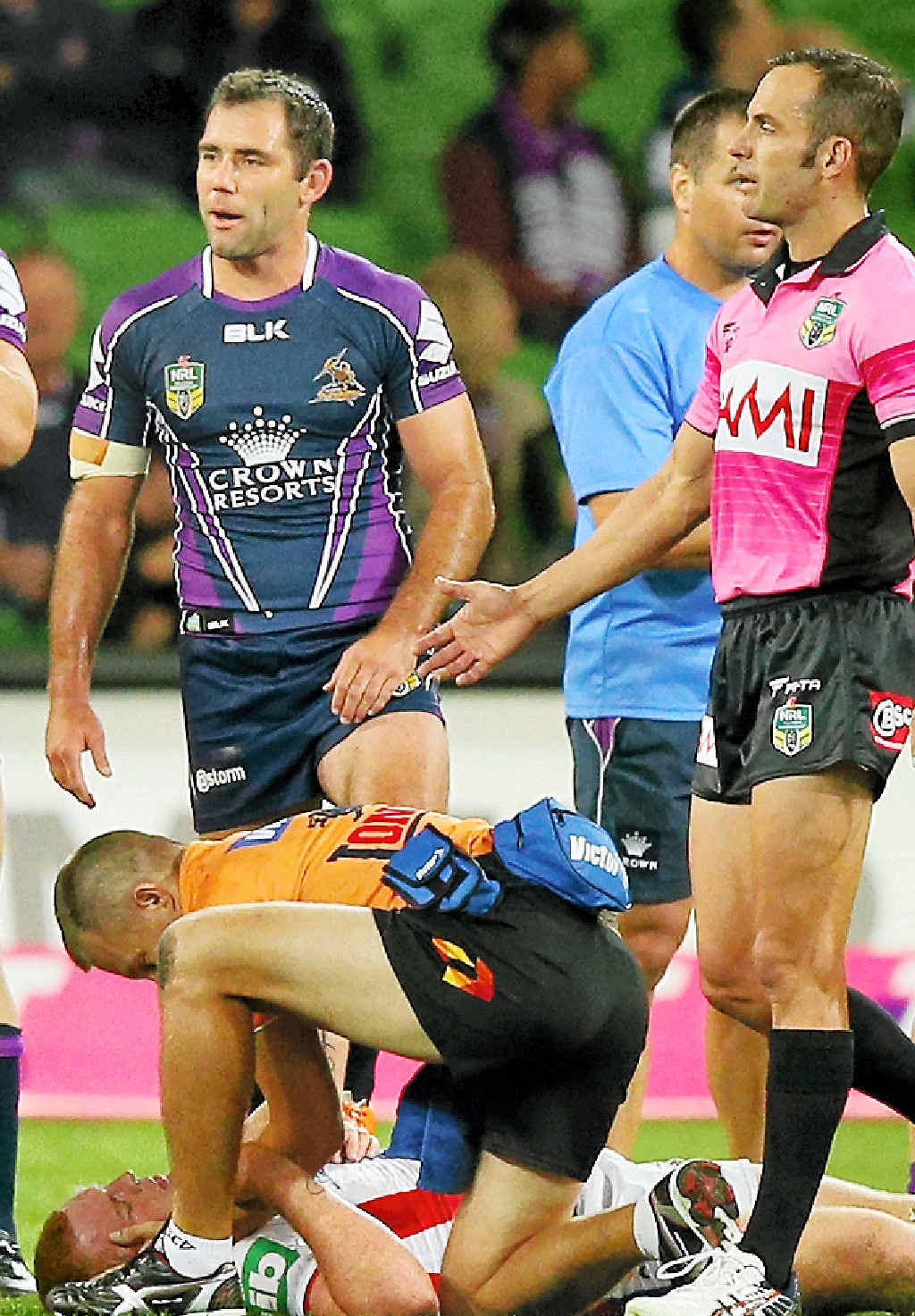 TOUGH TIME: Alex McKinnon of the Knights lies on the ground after being tackled as Cameron Smith of the Storm looks on. TOUGH TIME: Alex McKinnon of the Knights lies on the ground after being tackled as Cameron Smith of the Storm looks on.