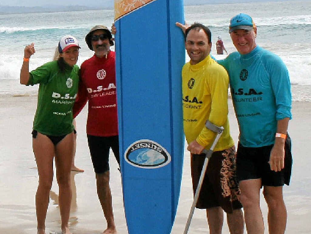 Organiser Margreet Wiegers, volunteer Ian Cohan, participant Tim Winton-Brown and volunteer Paul McNeil soak up the fun at the Disabled Surfing Association surf day at Clarkes Beach Byron Bay on Saturday. Organiser Margreet Wiegers, volunteer Ian Cohan, participant Tim Winton-Brown and volunteer Paul McNeil soak up the fun at the Disabled Surfing Association surf day at Clarkes Beach Byron Bay on Saturday.