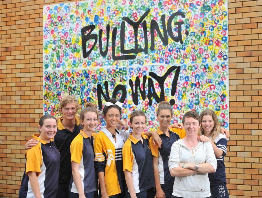 Gladstone State High teacher Niamh O'Sullivan with students Maddy Cushway, 17, Michael Eiser, 17, Taylah Crosbie, 16, Bree Smith, 16, Jillian McKewen, 17, Anna Williams, 16, Billie Chapman, 16, at the anti-bullying mural erected on Friday, National Day of Action Against Bullying and Violence. Gladstone State High teacher Niamh O'Sullivan with students Maddy Cushway, 17, Michael Eiser, 17, Taylah Crosbie, 16, Bree Smith, 16, Jillian McKewen, 17, Anna Williams, 16, Billie Chapman, 16, at the anti-bullying mural erected on Friday, National Day of Action Against Bullying and Violence.