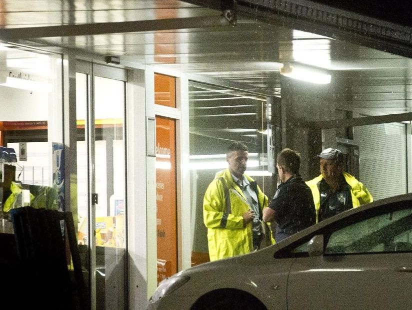 Police at a Mackenzie St foodstore next door to where two elderly residents were detained in their home by three men. Police at a Mackenzie St foodstore next door to where two elderly residents were detained in their home by three men.