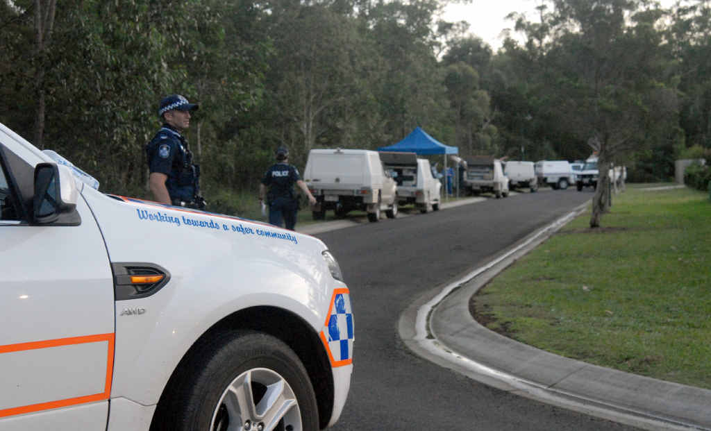 SHOCKING: Police guard the scene at Allan Ave, Glasshouse Mountains where a couple was found dead in a bedroom. SHOCKING: Police guard the scene at Allan Ave, Glasshouse Mountains where a couple was found dead in a bedroom.