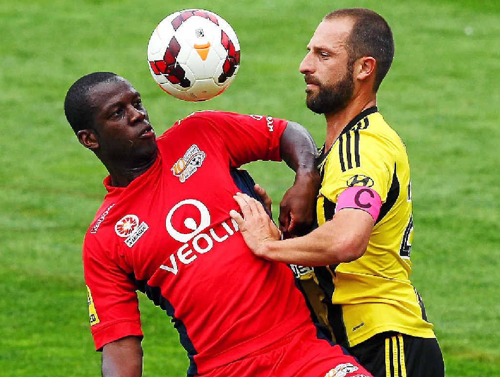 IN CONTROL: Adelaide’s Bruce Djite does battle with Wellington’s Andrew Durante. IN CONTROL: Adelaide’s Bruce Djite does battle with Wellington’s Andrew Durante.