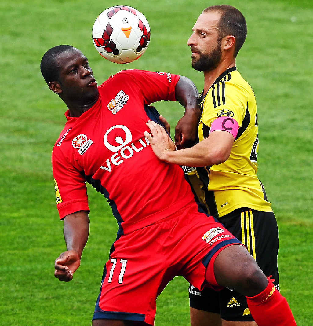 IN CONTROL: Adelaide’s Bruce Djite does battle with Wellington’s Andrew Durante. IN CONTROL: Adelaide’s Bruce Djite does battle with Wellington’s Andrew Durante.